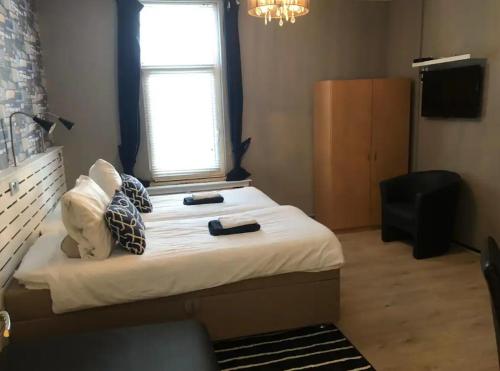 Кровать или кровати в номере Villa Insulinde