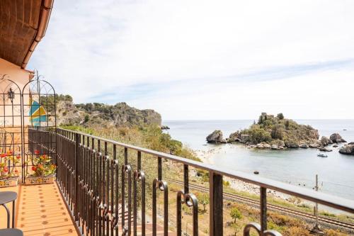 a balcony with a view of the ocean at Isola Bella - Rooms il Pescatore in Taormina