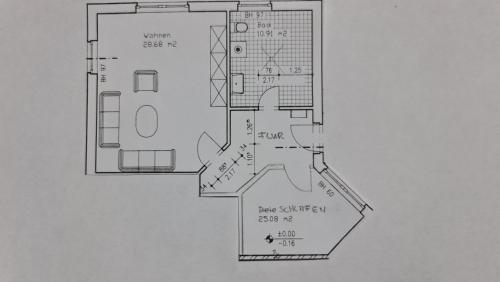 a drawing of a floor plan of a house at Haus 5 Elemente- Fewo Luft mit Terrasse und Bio-Kamin in Ostseebad Koserow
