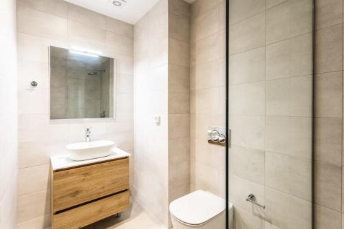 a bathroom with a toilet and a sink and a shower at Athens Grec Suites - The Ultimate City Getaways In Dafni in Athens