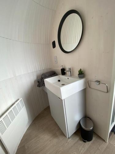 a white bathroom with a sink and a mirror at Jam First - Lydcott Glamping, Cornish Sea Views in East Looe