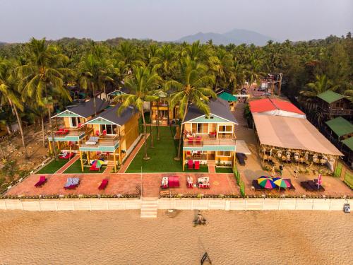 an aerial view of a house on the beach at The O2H Agonda Beach Resort in Agonda