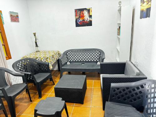 a room with chairs and tables and a table at 7 Calcosas in Valverde