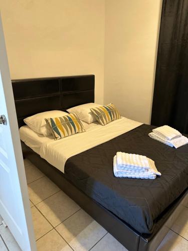 a bed with two towels on top of it at Appartement cosy - 3e arr in Marseille