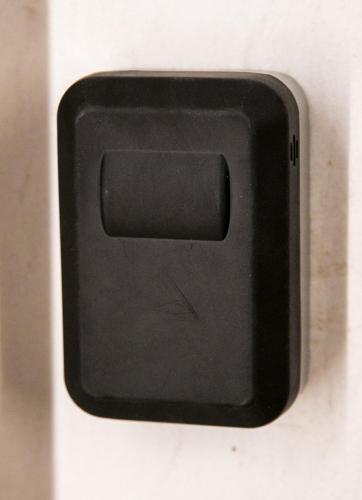 a black button on the side of a microwave at Mikel Angelo hall in Serres