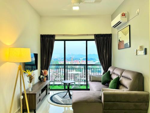 a living room with a couch and a balcony at The Horizon Ipoh by Yan's Home - Sky Infinity Pool in Ipoh