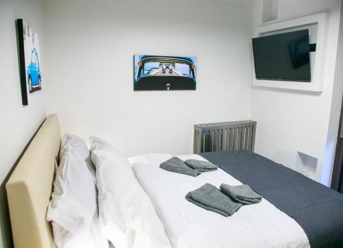 a bedroom with a bed with towels on it at Mikel Angelo hall in Serres
