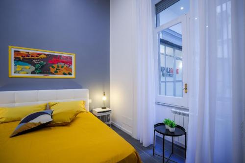Katil atau katil-katil dalam bilik di Napoli Games Apartments by Dimorra