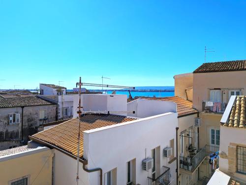 a view of roofs of buildings in a city at La Casa Delle Fate in Siracusa