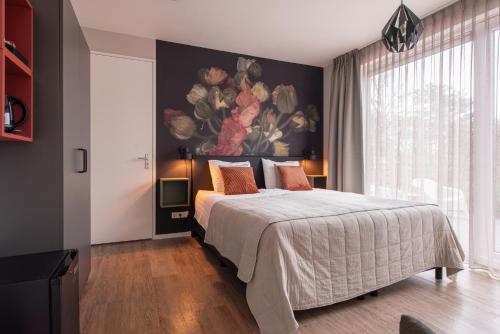 Giường trong phòng chung tại Villa Zoutelande