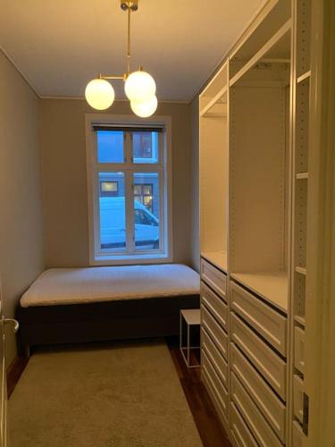 a bedroom with a bed and a window in it at Lovely apartment in Bergen in Bergen