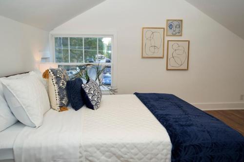 a bedroom with a bed with pillows and a window at Cozy Retreat Near Downtown, Atl in Atlanta