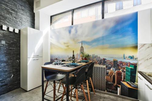 a dining room with a view of a city at Le somptueux saint-clair in Caluire-et-Cuire