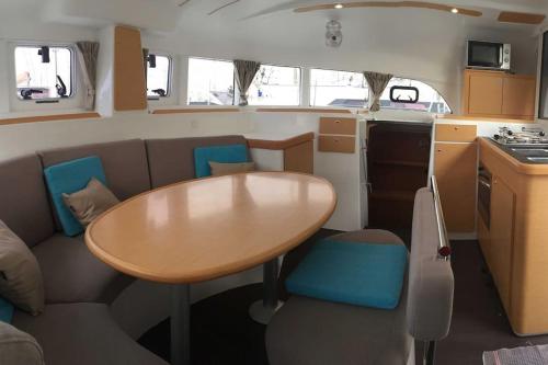 a dining area with a table and chairs in an rv at Cristal de Mer - Cannes in Cannes