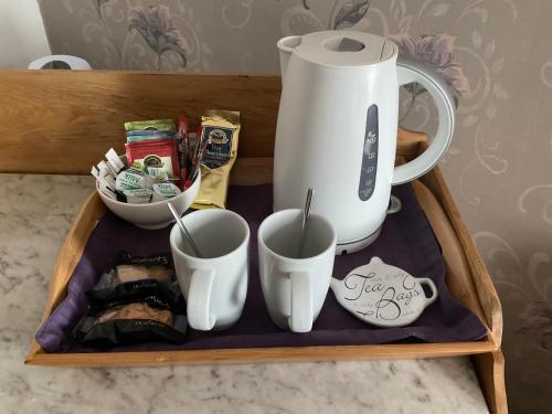 a tray with a coffee maker and cups on it at Overdale Guesthouse and Free Parking in Whitby