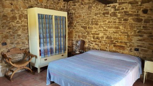 Säng eller sängar i ett rum på Agriturismo Corte del Gallo