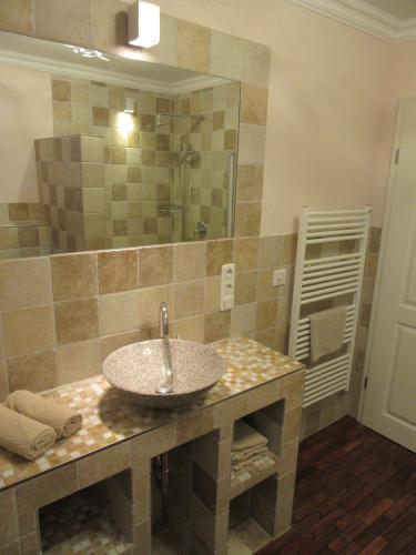 a bathroom with a sink and a mirror at Ferienwohnung Strand EG in Fehmarn