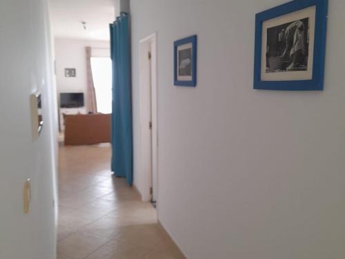 a hallway with blue and white walls and a room at Pandora Ocean View am Praia Cabral in Sal Rei