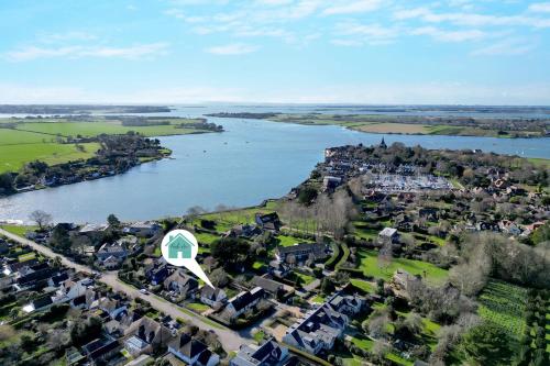 an aerial view of a town next to a river at Newly Renovated Cottage 150m from Waterfront in Bosham