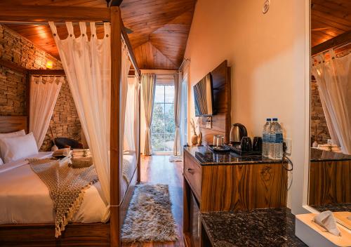 a bedroom with a bed and a sink in it at Moustache Bhimtal Luxuria, Nainital in Bhīm Tāl