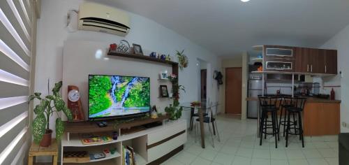 a living room with a flat screen tv on a wall at Apartamento Céntrico 2 Dormitorios in Santa Cruz de la Sierra