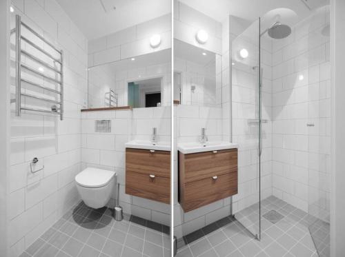 a bathroom with a toilet and a sink and a shower at Brand new Studios Amidst Ancient Ruins Oasis in Stockholm