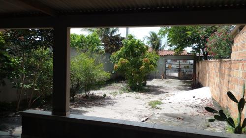 a view of a yard from a window at Lazer à beira mar in Alcobaça