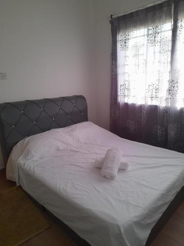 Ein Bett oder Betten in einem Zimmer der Unterkunft Homestay Putatan Kg.Duvanson