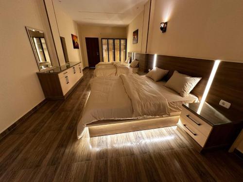 a large bedroom with two beds in it at Narmer Pyramids View in Cairo