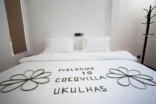 Ein Bett oder Betten in einem Zimmer der Unterkunft Coco Villa Ukulhas