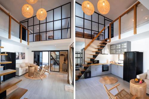 ランタ島にあるLuxury Beachhouse Manao Villasのリビングルームとキッチン付きの家の景色を望めます。