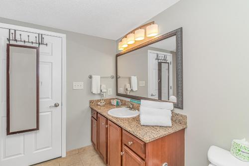 a bathroom with a sink and a mirror at Stunning Double Balcony- Oceanfront 2 Bedroom, 2 Bath- Anderson Ocean Club 905 in Myrtle Beach