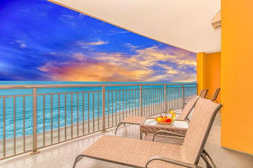 a balcony with chairs and a view of the ocean at Stunning Double Balcony- Oceanfront 2 Bedroom, 2 Bath- Anderson Ocean Club 905 in Myrtle Beach