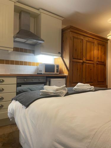 a kitchen with a large bed in a room at The Steam Packet in Littlehampton