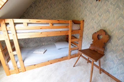 Cama o camas de una habitación en Le Refuge Rustique. (accepte les animaux)