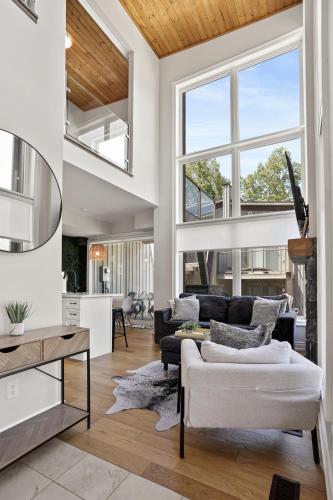 a living room with a couch and a table at Muskoka Bay Resort in Gravenhurst