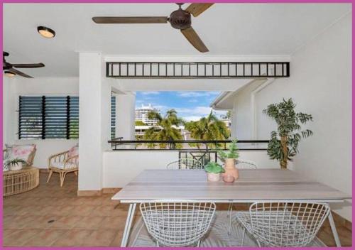 a dining room with a table and chairs at Breakwater 44 in Townsville