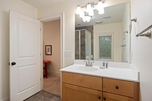 a bathroom with a sink and a mirror at 152 Augusta National in Kiawah Island
