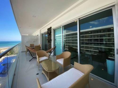 an apartment balcony with a view of the ocean at Wynwood Ultra in Cartagena in Cartagena de Indias