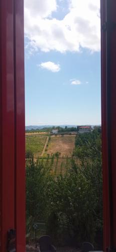 a view of a field from a window at A casa di Anna in Vaglio Serra