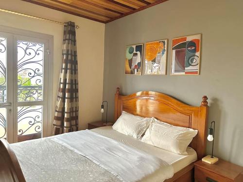 Un pat sau paturi într-o cameră la Appart 2 Ch Nkomo