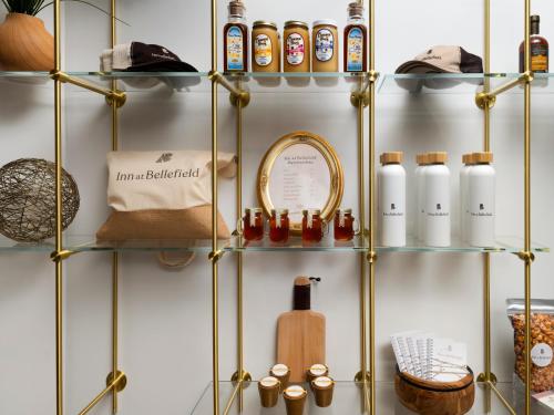 a shelving unit with bottles on it at Inn at Bellefield Residence Inn by Marriott in Hyde Park