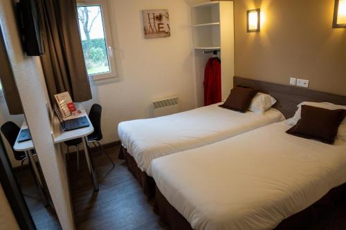 Cama o camas de una habitación en Fasthôtel Périgueux - Un Hôtel FH Confort
