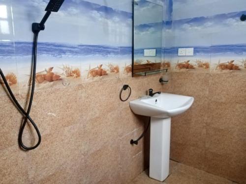 a bathroom with a shower and a sink at freedom house in Unawatuna