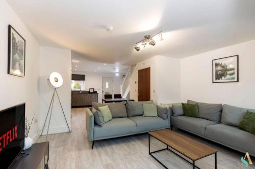 a living room with a couch and a table at Wharf House TSAC in Stockton-on-Tees