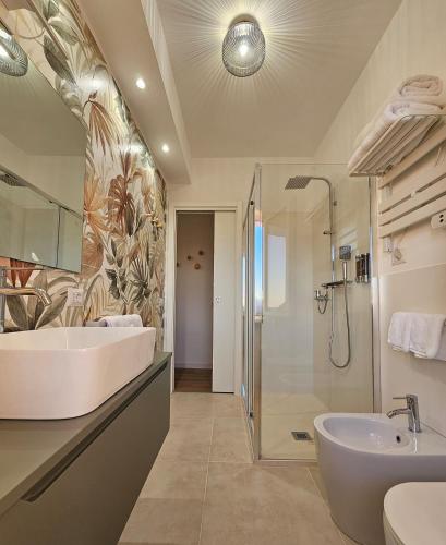 a bathroom with a tub and a sink and a shower at B&B Domus Teano Luxury Rooms in Rome