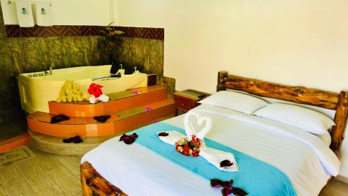 a bedroom with a bed with a rabbit on it at Balcones del Paraíso in Baños
