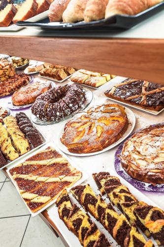 a display of different types of breads and pastries at Hotel Atlantic in Gatteo a Mare
