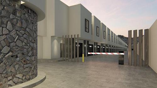 a rendering of a building with a stone wall at MOTEL CIES in Mexicali