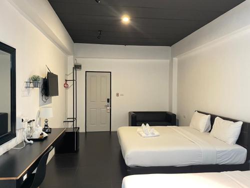 Katil atau katil-katil dalam bilik di Azz Hotel